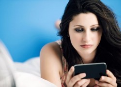 1486835977Teenage-girl-using-mobile-phone-on-bed.jpg